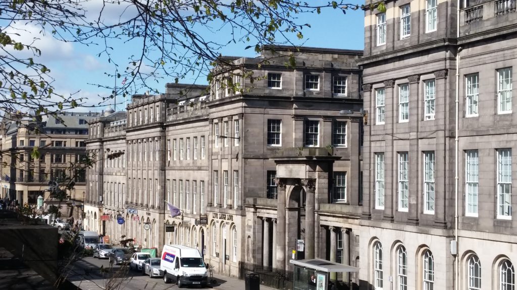 A view of Waterloo Place in Edinburgh's New Town, showing the stunning Georgian architecture.