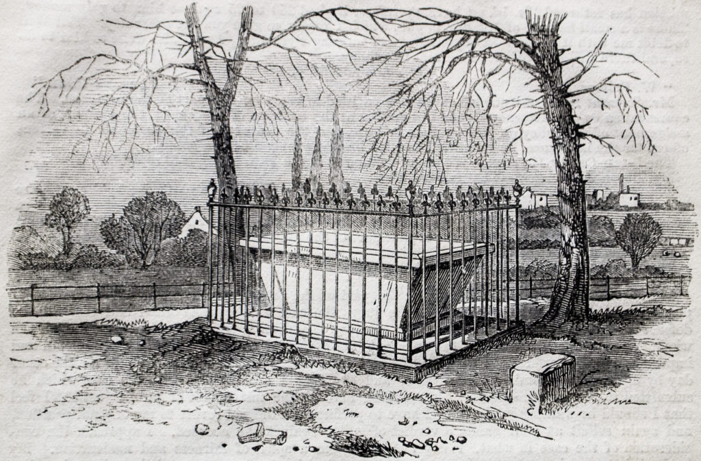 An engraving of a tomb with railings around it.