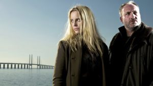 Saga and Martin stand in front of the Oresund Bridge