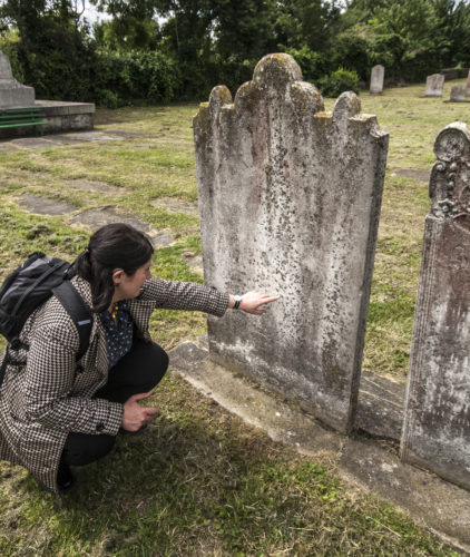 Reading the headstone of Taylor's parents in Northfleet, Kent